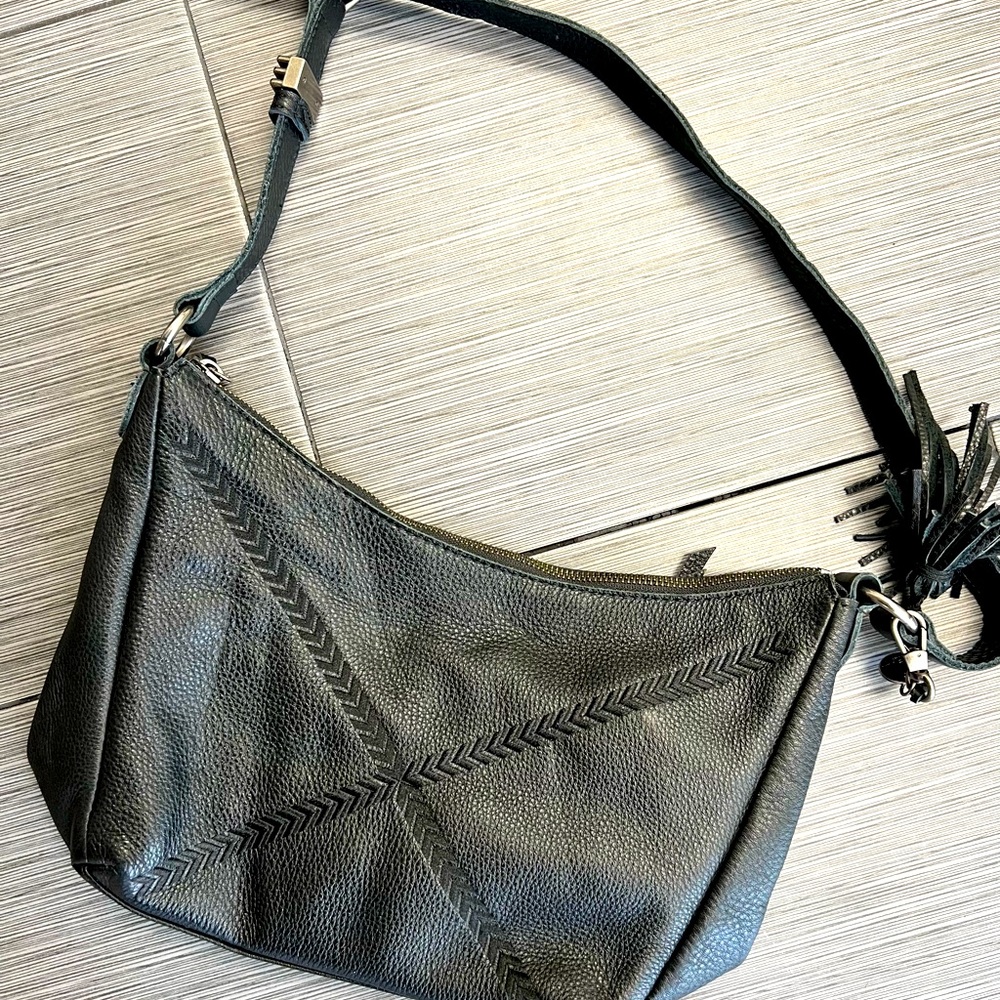 Barely used The Sak purse in black. Great condition!